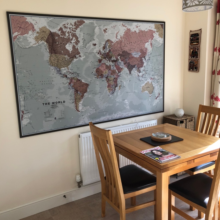 Within my blog about renting out a room on Airbnb, this is a picture of the giant world map on my kitchen wall
